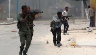 Somali government soldiers run to take their positions during gunfire after a suicide bomb attack in Somalia's capital Mogadishu. REUTERS/Feisal Omar/File Photo.