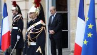 French foreign affairs minister Jean Yves Le Drian stands at the entrance of the castle of la Celle Saint cloud for a summit from the underfunded G5 Sahel anti-terror coalition on December 13, 2017. / AFP / ludovic MARIN.