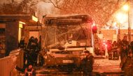 Russian officials inspect the scene after a bus plowed into a Moscow subway entrance, leaving at least five people dead and 15 injured, in Moscow, Russia on December 25, 2017. Sefa Karacan - Anadolu