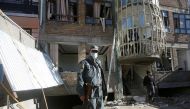 An Afghan policeman keeps watch at the site of a suicide attack in Kabul, Afghanistan December 28, 2017. REUTERS/Omar Sobhani