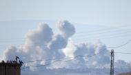 Smoke rises after Assad regime's warplane carried out airstrikes over Thamanyah district of Idlib in Syria on December 26, 2017. Ekrem Masry - Anadolu
