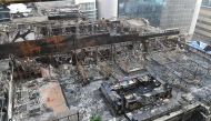 View of a burned building where a rooftop party was being held in Mumbai early on December 29, 2017. AFP / INDRANIL MUKHERJEE