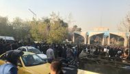 People protest near the university of Tehran, Iran December 30, 2017 in this picture obtained from social media. REUTERS. 