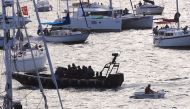 A police boat checks spectator craft as they wait for the annual new year fireworks as part of celebrations on Sydney Harbour, Australia, December 31, 2017. REUTERS/David Gray.