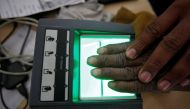 A file photo of a villager as he goes through the process of a fingerprint scanner for the Unique Identification (UID) database system at an enrolment centre at Merta district in the desert state of Rajasthan, India, February 22, 2013. REUTERS/Mansi Thapl
