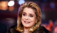 French actress Catherine Deneuve posing on the red carpet for the premiere of the film 