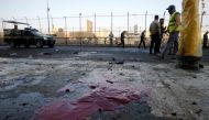 Iraqi security forces inspect the site of a bomb attack in Baghdad, Iraq January 15, 2018. REUTERS/Khalid al Mousily