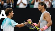Rafael Nadal of Spain shakes hands with Diego Schwartzman of Argentina after Nadal won their match. REUTERS/Thomas Peter
