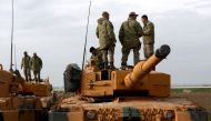 Turkish soldiers prepare their tanks near the Syrian-Turkish border, at Reyhanli district in Hatay, Turkey, 21 January 2018. EPA/SEDAT SUNA
