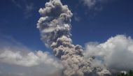 A giant mushroom-shaped cloud rises into the air from the Mayon volcano, seen from the highway in the town of Camalig, near Legazpi City in Albay province, south of Manila on January 22, 2018. AFP 