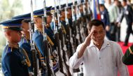 Philippine President Rodrigo Duterte (R) salutes military honor guards during departure rites from the Ninoy Aquino International Airport in Manila, Philippines, 24 January 2018. EPA/ROLEX DELA PENA