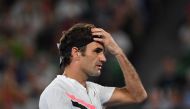 Switzerland's Roger Federer gestures against Czech Republic's Tomas Berdych during their men's singles quarter-finals match on day 10 of the Australian Open tennis tournament in Melbourne on January 24, 2018. (AFP / SAEED KHAN)