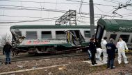 Italian policemen work on the site of a train crash on January 25, 2018 in Pioltello, near Milan. AFP / Piero CRUCIATTI