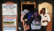 Indian girls prepare to enter the cinema hall before the scheduled show of Bollywood film 'Padmaavat' in Mumbai on January 25, 2018.  AFP / Punit Paranjpe