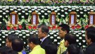 South Korean President Moon Jae-In (C) visits a joint memorial altar for the victims of a hospital fire at a gymnasium in Miryang on January 27, 2018. AFP / Jung Yeon-Je