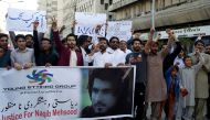 File photo of people chanting slogans and holding signs as they condemn the death of Naqibullah Mehsud, during a protest in Karachi, Pakistan January 21, 2018. REUTERS/Akhtar Soomro