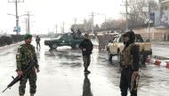 Afghan security forces stand near the Marshal Fahim military academy after a series of explosions in Kabul, Afghanistan January 29, 2018. REUTERS/Mohammad Ismail	
