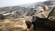 File photo of Rohingya refugees walk along the Kutupalong refugee camp in Cox's Bazar, Bangladesh, January 21, 2018. REUTERS/Mohammad Ponir Hossain/File Photo
