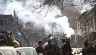 Afghan security officials inspect the blast site in Kabul, Afghanistan on January 27, 2018. Haroon Sabawoon - Anadolu 