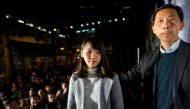 Pro-democracy activist Agnes Chow (L) stands on the stage with former lawmaker Edward Yiu Chung-yim (R) during a protest outside Central Government Complex in Hong Kong on January 28, 2018. AFP / Philip Fong