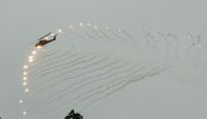 A US-made AH-1W Super Cobra helicopter launches flares during an annual drill at the military base in the eastern city of Hualien on January 30, 2018. AFP / Mandy Cheng 