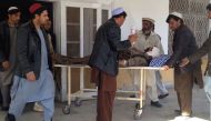 Pakistani relatives transport an injured blast victim at a hospital in Kurram tribal district on January 30, 2018. AFP 