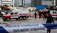 Members of the police bomb squad cordon off an area where a World War Two bomb was found at a construction site in Hong Kong, China January 31, 2018. REUTERS/Bobby Yip
