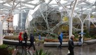 People take a tour during the grand opening of the Amazon Spheres, in Seattle, Washington on January 29, 2018.  AFP / JASON REDMOND
