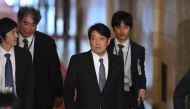 Japan's Defence Minister Itsunori Onodera (2nd R) arrives at parliament to attend a session of the House of Representatives Budget Committee in Tokyo on February 5, 2018. / AFP / Kazuhiro NOGI
