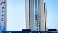 A photograph taken on February 5, 2018, shows the North Korean national flag displayed outside their dormitory across three stories at the athletes' village in Gangneung, ahead of the Pyeongchang 2018 Winter Olympic Games.  AFP / MLADEN ANTONOV