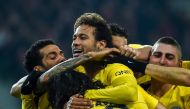 Paris Saint-Germain's Brazilian forward Neymar (C) celebrates with teammates after scoring a goal during French L1 football match between Lille Losc and Paris Saint-Germain (PSG), at the Pierre-Mauroy stadium, in Villeneuve-d'Ascq, on February 3, 2018. / 