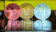 A picture taken on February 6, 2018 shows a visual representation of the digital crypto-currency Bitcoin, at the 