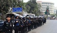 Bangladesh police stand guard in Dhaka following a verdict in the corruption case of Bangladesh's main opposition leader and Bangladesh Nationalist Party chairperson Khaleda Zia in Dhaka on February 8, 2018. AFP / Munir Uz Zaman 