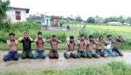 Ten Rohingya Muslim men with their hands bound kneel in Inn Din village September 1, 2017. Handout via Reuters