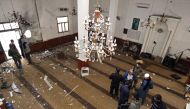 Libyans inspect the interior of a mosque in Benghazi on February 9, 2018, after it was hit with a twin bomb attack. AFP / Abdullah Doma 
 

