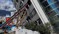 A rescuer rushes to a collapses building after an earthquake hit Hualien, Taiwan February 10, 2018. REUTERS/Tyrone Siu