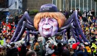 A carnival float shows Christian Democratic Union (CDU) leader and German Chancellor Angela Merkel as black widow at the traditional 