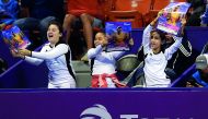 Young spectators cheer Maria Sharapova during her first round match at the Khalifa International Tennis and Squash Complex in Doha yesterday.