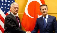 US Secretary of Defence Jim Mattis poses with Turkish Defence Minister Nurettin Canikli during NATO defence ministers meeting at the Alliance headquarters in Brussels, Belgium, February 14, 2018. REUTERS/Virginia Mayo/Pool