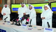 Qatar Volleyball Association  (QVA) President Ali Ghanim Al Kuwari (second left) and Katara Cultural Village Foundation General Manager and Katara Beach Volleyball Cup 2018 Tournament Director Dr Khalid bin Ibrahim Al Sulaiti exchanging documents during a