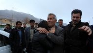 Relatives of a passenger who was believed to have been killed in a plane crash react near the town of Semirom, Iran, February 18, 2017. REUTERS/Tasnim News Agency 