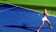 Estonia's Anett Kontaveit returns the ball to Samantha Stosur of Australia during day two of the WTA Dubai Duty Free Tennis Championship at the Dubai Tennis Stadium on February 20, 2018. AFP / Karim Sahib