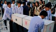 Funeral workers carry a crate containing the body of Joanna Demafelis, a Filipina domestic helper who was killed and found inside a freezer in Kuwait, in her hometown in Iloilo province in the Philippines February 17, 2018. Reuters/Erik De Castro