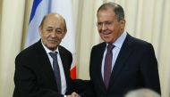 French Minister for Foreign and European Affairs Jean-Yves Le Drian (L) and Russian Foreign Minister Sergei Lavrov (R) shake hands during a joint press conference in Moscow, Russia, on February 27, 2018. (Sefa Karacan / Anadolu Agency)