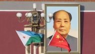 FILE PHOTO - Djibouti and Chinese national flags are seen in front of the portrait of China's late Chairman Mao Zedong at Tiananmen Square, ahead of a welcoming ceremony for Djibouti's President Ismail Omar Guelleh, in Beijing, China November 23, 2017. Re
