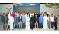 Abdulaziz bin Nasser Al Khalifa, Qatar Development Bank CEO and QBIC Chairman(sixth left, front row);  Aysha Al Mudahka, QBIC CEO (centre, front row); and Charles Adler (fifth left), co-founder of Kickstarter, with participants at the Speaker Series sessi