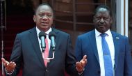 Kenya's President Uhuru Kenyatta (L) and National Super Alliance (NASA) coalition opposition leader Raila Odinga give a press conference at the Harambee house office in Nairobi, on March 9, 2018. AFP / Simon Maina