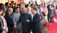 French President Emmanuel Macron (centre R) introduces French Foreign Minister Jean Yves Le Drian (L) to Indian President Ram Nath Kovind (C) during a ceremonial reception at the Indian Presidential Palace in New Delhi on March 10, 2018.  AFP / POOL / Lud