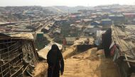 A woman walks up a hill in the Kutupalong camp for Rohingya refugees in southern Bangladesh, February 11, 2018. Picture taken February 11, 2018. REUTERS/Andrew RC Marshall
