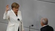 German Chancellor Angela Merkel is sworn-in by Parliament President Wolfgang Schaeuble during a meeting of Germany's lower house of parliament Bundestag in Berlin, Germany, March 14, 2018. REUTERS/Kai Pfaffenbach
